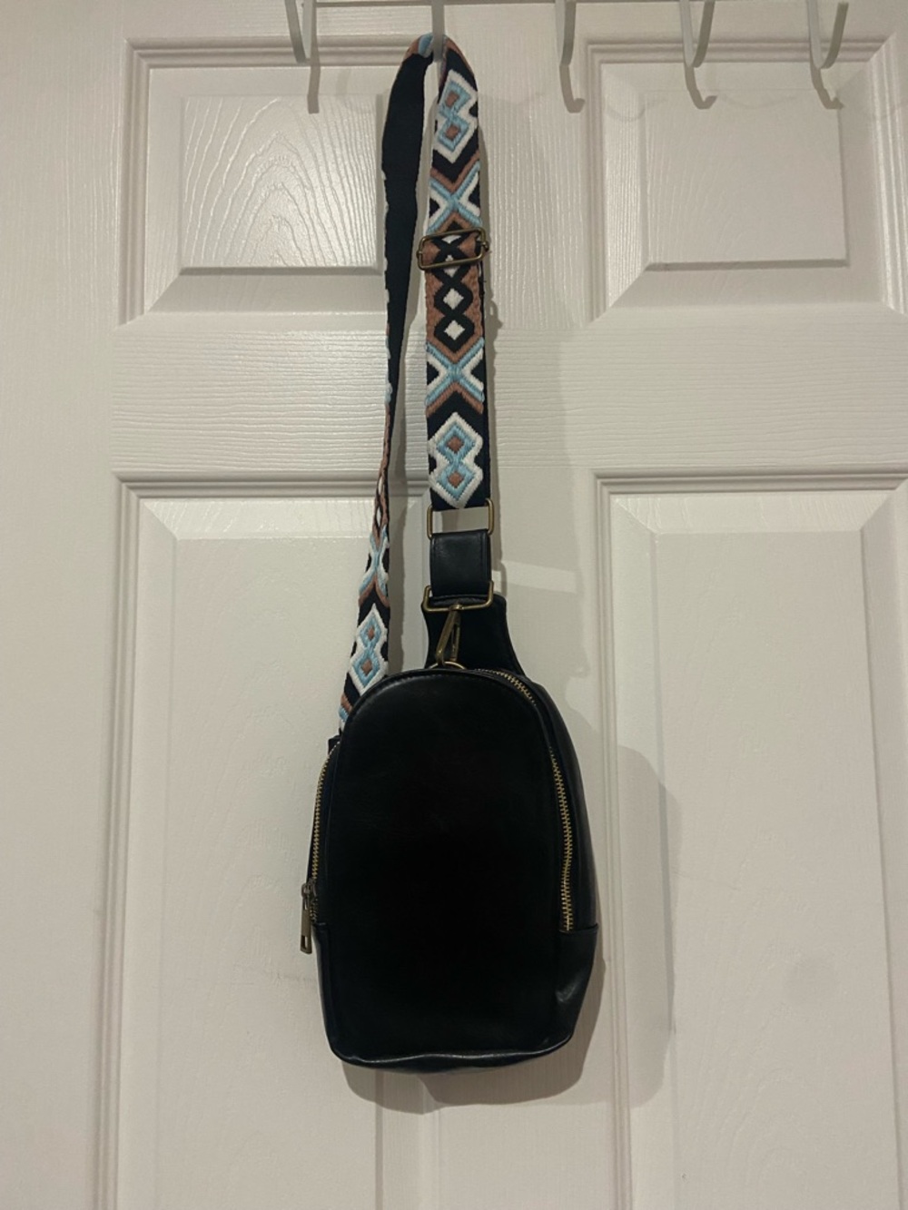 Black Crossbody Sling Bag with Patterned Strap